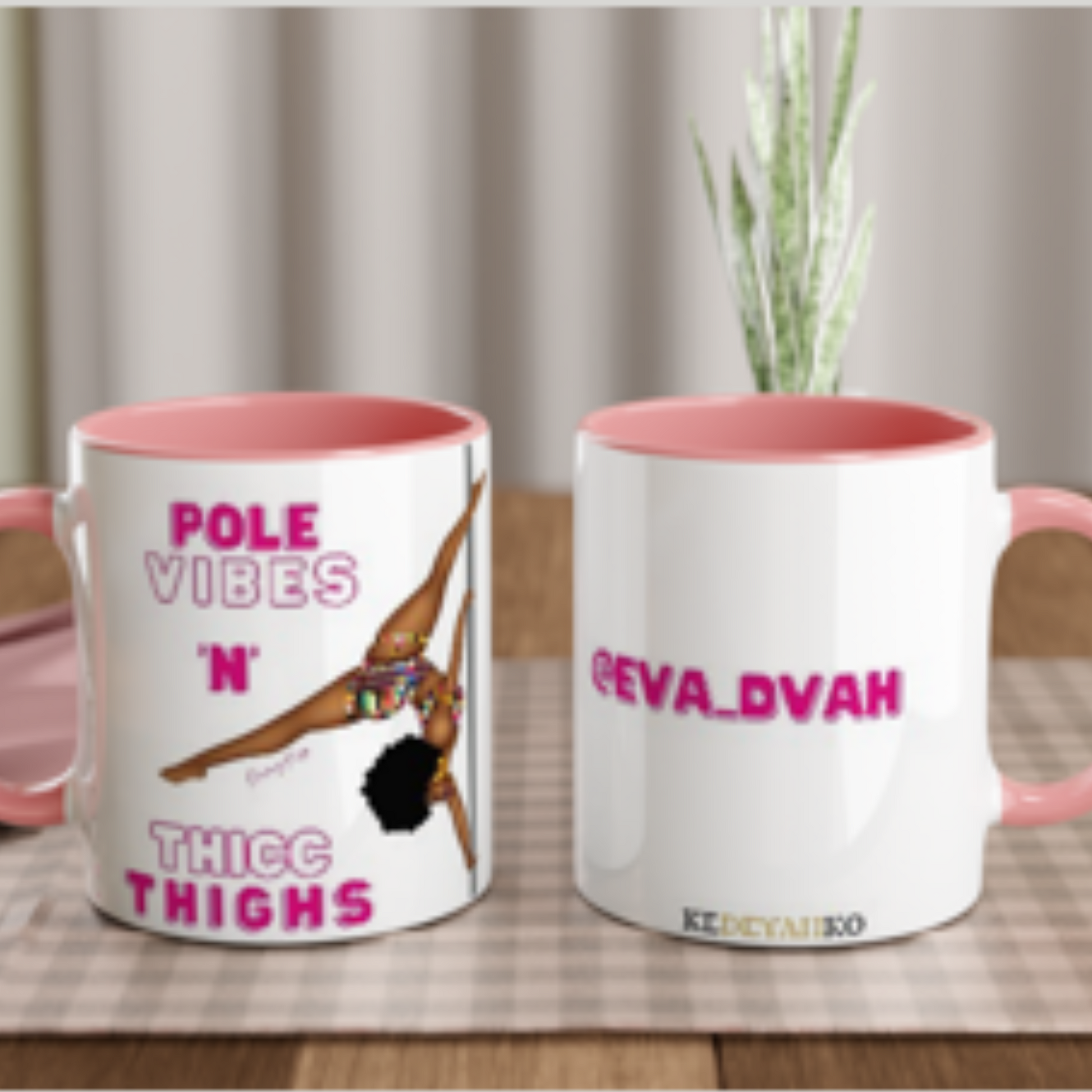 White mug with pink coloured rim, inside, and handle. featuring a black pole dancer wearing bright African inspired Afrocentric garter pole shorts and sports top. Bright pink knee socks and clear platform heels in an extended butterfly pole pose with slogan affirmation pole vibes n thicc vibes